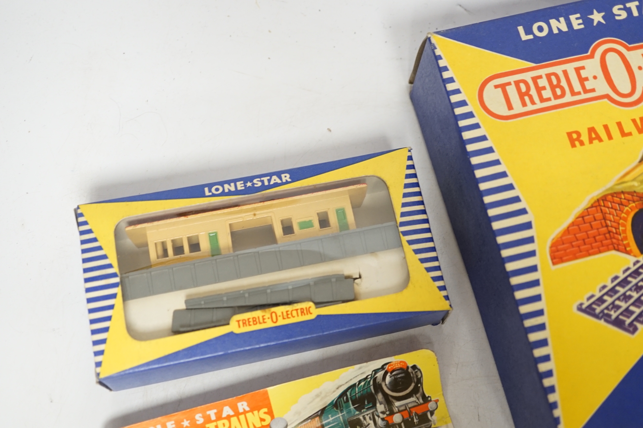 Sixty-two boxed items of Lone Star 000 gauge model railway including; a tunnel, Brake End Coaches, bogie wagons, station platforms, platform extensions, signal boxes, box vans, and telegraph poles